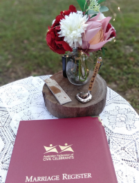Marriage register and decorations on registry table at wedding in Townsville with celebrant Amanda Medill