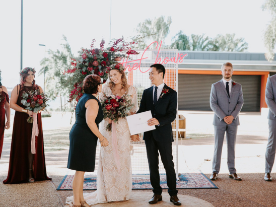 Wedding ceremony with married couple and wedding certificate in Townsville with marriage celebrant Amanda Medill