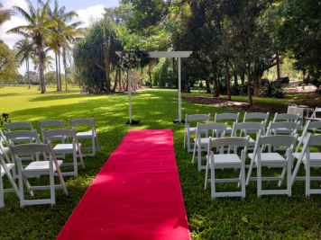 Wedding aisle red carpet and furniture at marriage ceremony in Townsville with celebrant Amanda Medill